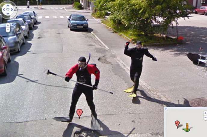 men in diving suits chasing a google car